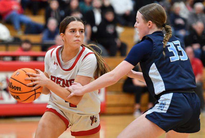 Benet’s Ava Mersinger looks to pass while defended by Nazareth’s Molly Moore (33) during a game on January 29, 2025 at Benet Academy in Lisle.