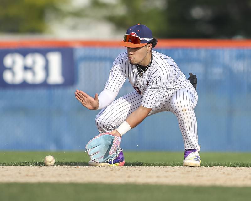 Oswego's Gabe Herrera (9) fields a grounder during baseball game between Plainfield North at Oswego, Thursday, April 24, 2025 in Oswego.