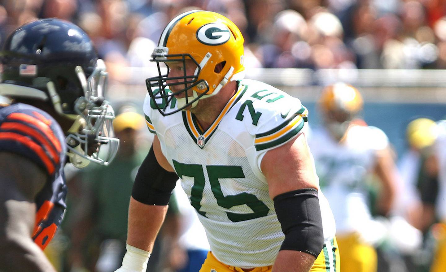 Crystal Lake native and Green Bay tackle Bryan Bulaga blocks against the Bears in the first half Sunday at Soldier Field.