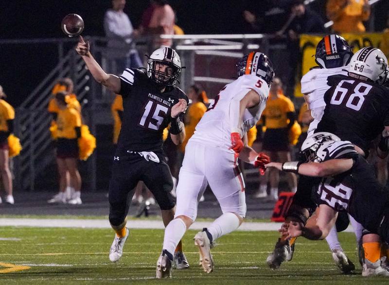 Plainfield North's Nicholas Darwish (15) throws a pass against Oswego during a football game at Plainfield North High School on Friday, Sept. 22, 2023.