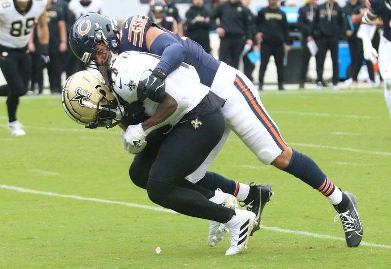 Chicago Bears linebacker T.J. Edwrads brings down New Orleans Saints running back Alvin Kamara on Sunday, Oct. 19, 2025 at Soldier Field in Chicago.