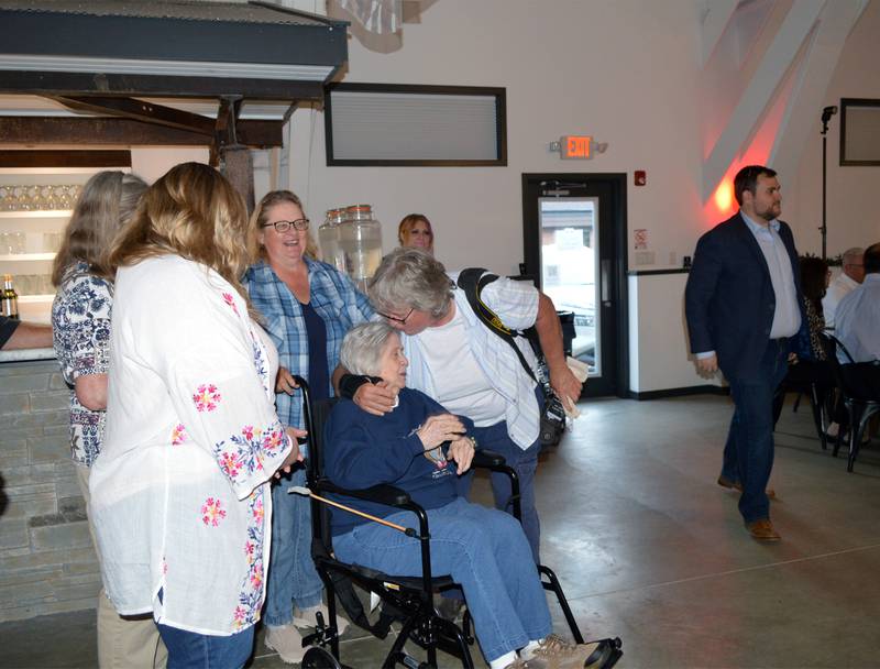 Oregon Area Chamber of Commerce Citizen of the Year Earleen Hinton (right) kisses her mother, Ida Hinton, while celebrating with her family after accepting the award on Thursday, Aug. 15, 2024, at River's Edge Experience in Oregon.