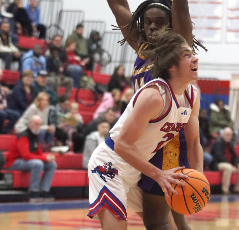 Dundee-Crown’s Jared Russell drives to the hoop against Wauconda in varsity basketball Friday, Dec. 20, 2024 at Dundee-Crown High School in Carpentersville.