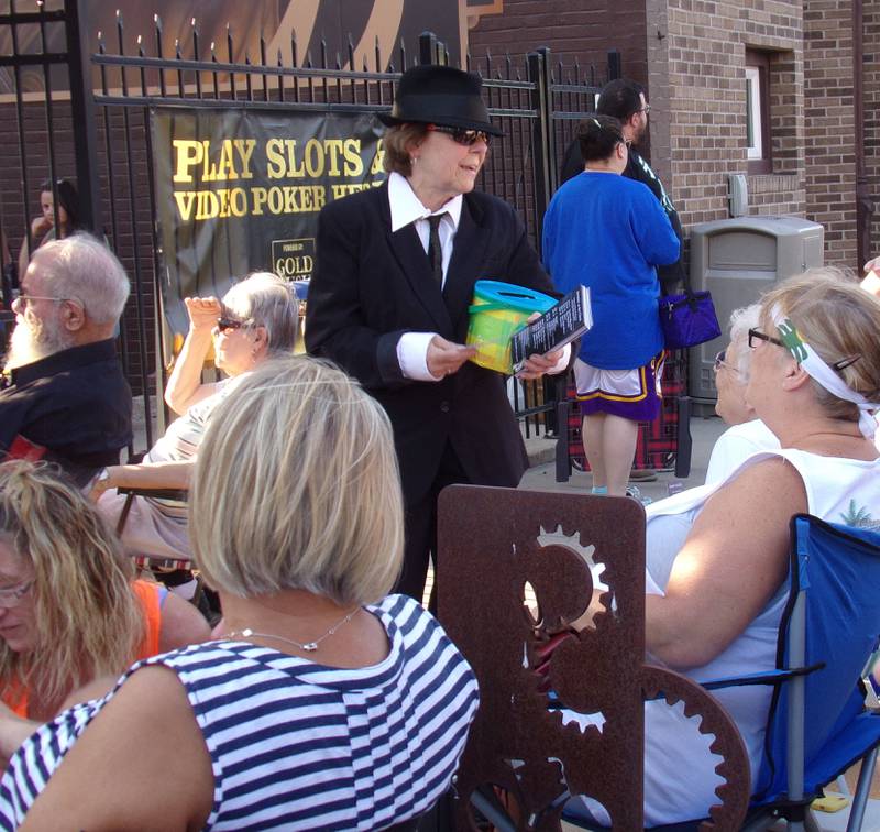 Jammin' at the Clock co-organizer Toni Pettit dressed as a Blues Brother on Friday, June 2, 2023, to welcome the Smokers Blues Band to Heritage Park in Streator.