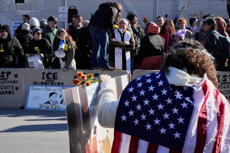 Protesters gather outside an ICE processing facility in Broadview, Ill. a suburb of Chicago, Friday, Oct. 24, 2025. (AP Photo/Nam Y. Huh)