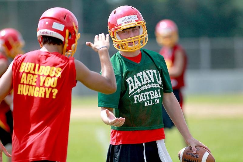 Batavia’s Kyle Niemiec greets a teammate during their first day of practice at the school.