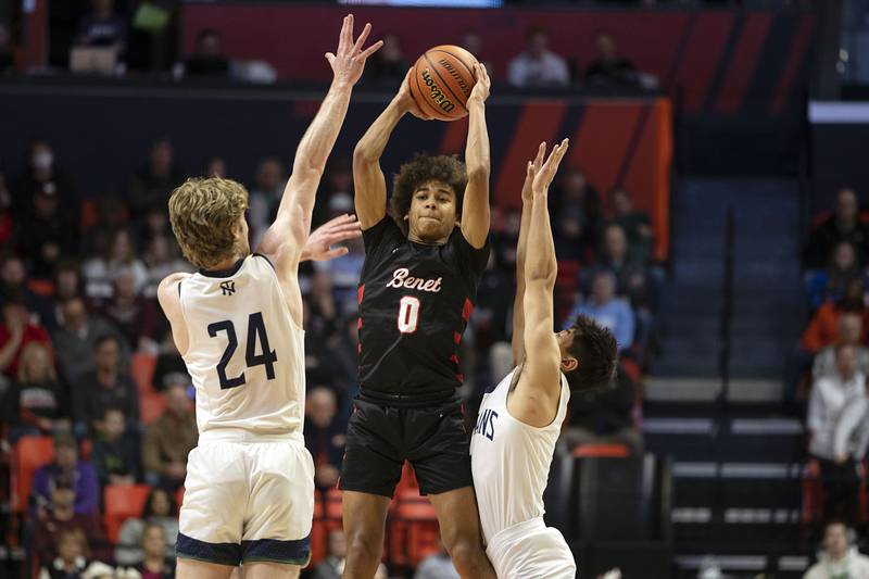 Benet Academy’s Brayden Fagbemi makes a pass against New Trier Friday March 10, 2023 during the 4A IHSA Boys Basketball semifinals.