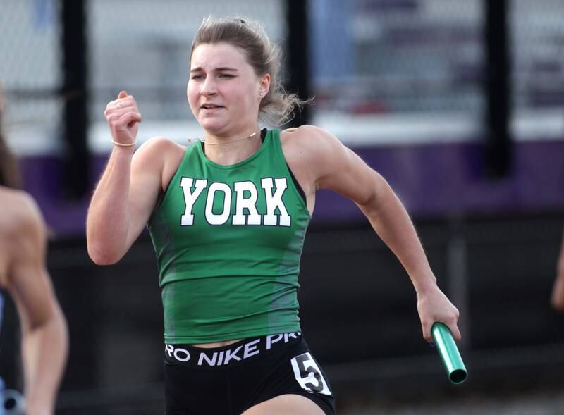 York’s Elaine Paul runs the anchor leg of the 4x100-meter relay during the Ritter Invite girls track and field meet at Downers Grove North on Friday, April 14, 2023.
