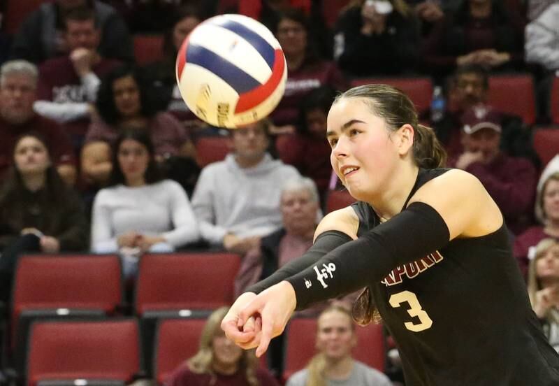 Lockport libero Sadie Denk returns a serve against Marist during the Class 4A State semifinal game on Friday, Nov. 15, 2024 at CEFCU Arena in Normal.