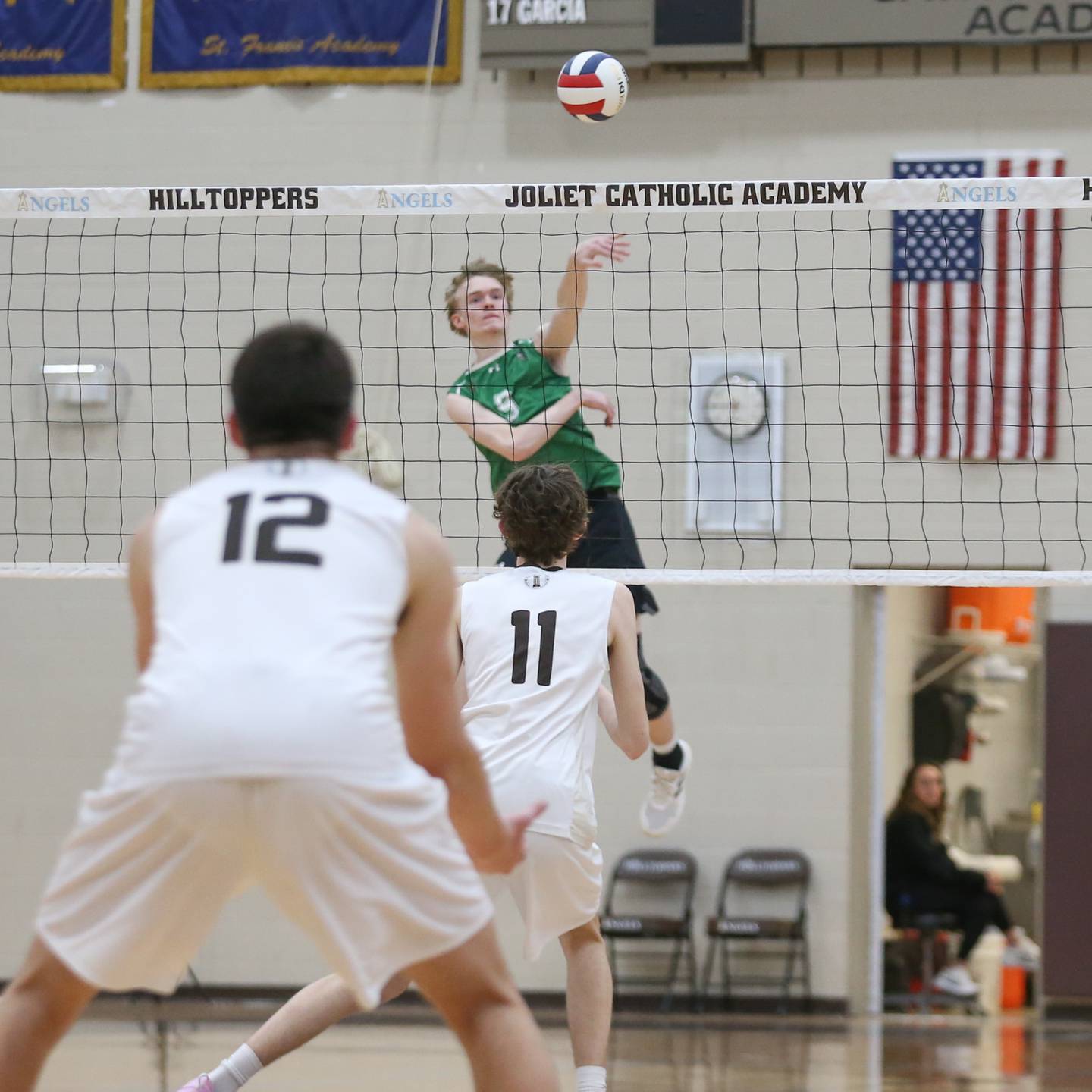 Providence Catholic's Jackson Fowler (9) spikes the ball during volleyball match between Providence Catholic at Joliet Catholic.  March 25, 2025.