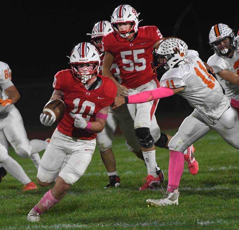 Oregon's Keaton Salsbury (10) avoids a Winnebago defender on Friday, Oct. 17, 2025 at Landers-Loomis Field in Oregon.