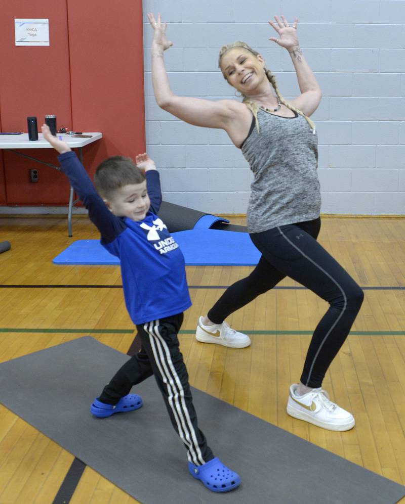 Wyatt Levy gets some instruction from Yoga Instructor Chris Porter on Saturday, April 20, 2024, during a quick lesson during the Healthy Kids Day at the Streator Y.