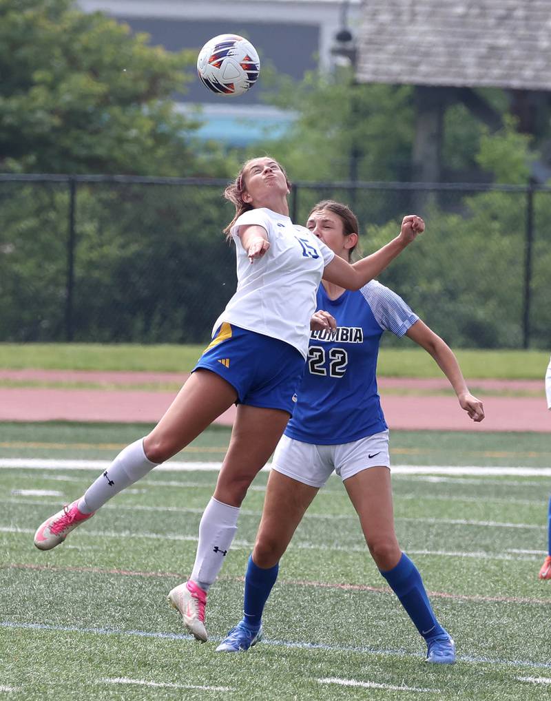 Johnsburg's Lauren McQuiston heads the ball in front of Columbia's Emily Rose Saturday, June 7, 2025, during the IHSA Class 1A state championship game at North Central College in Naperville.
