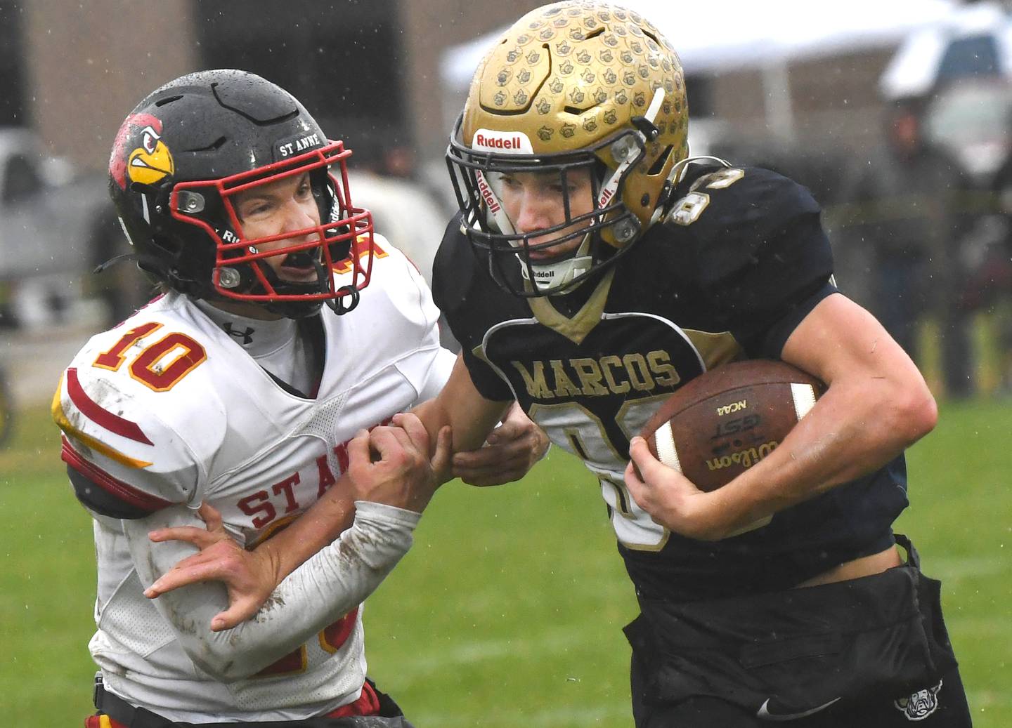 Polo's Mercer Mumford (83) battles for yards as St. Anne's Grant Pomaranski (10) tries to bring him down during I8FA playoff action on Saturday, Nov. 8, 2025 at Polo High School. The Marcos won the game 46-14 to advance to the next round.