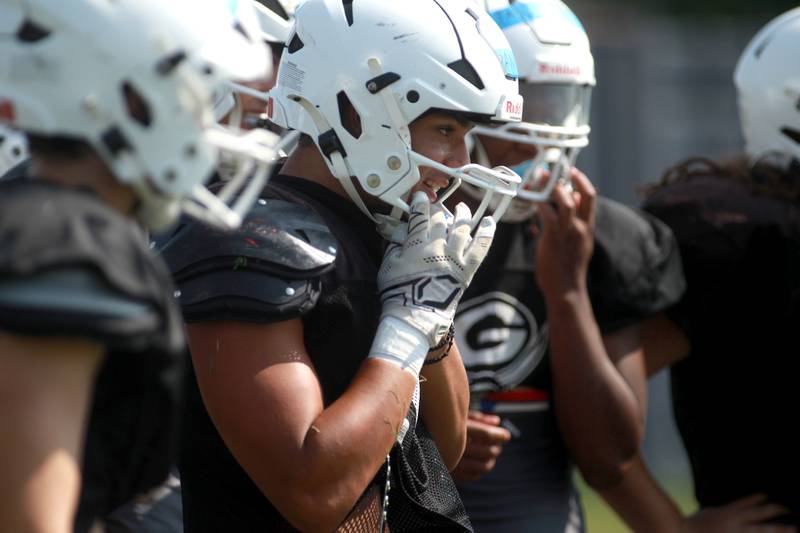 Glenbard South’s Ari Ioannou with his team during a joint practice with Sterling and Oswego East football teams on Tuesday, July 15, 2025 in Oswego.
