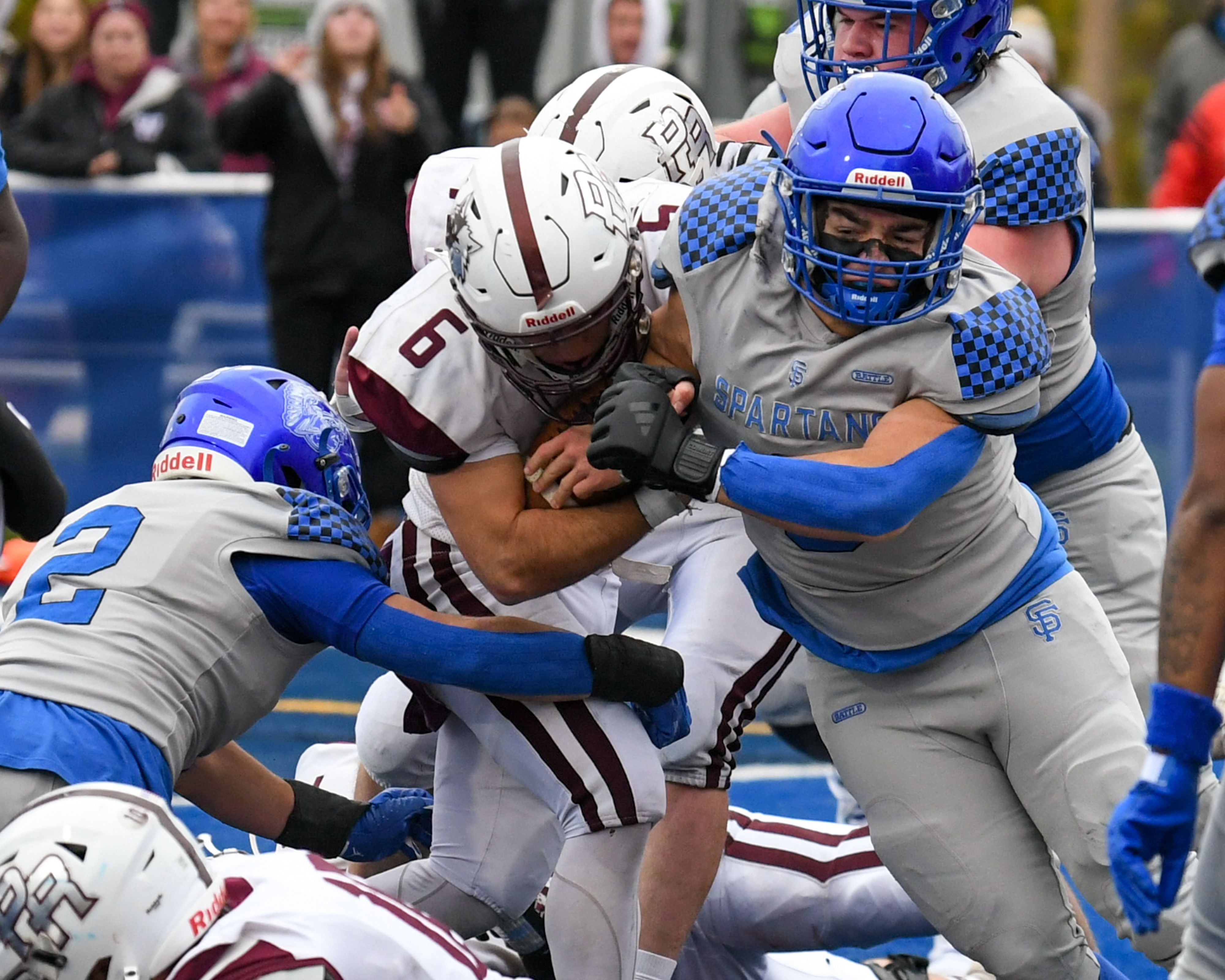 Prairie Ridge's Luke Vanderwiel (6) gets a touchdown while being defended by St. Francis's  teammates Peyton Shipley (2) and Preston Shipley (9) during the second round of the 5A playoff game on Saturday Nov. 8, 2025, held at St. Francis's High School.