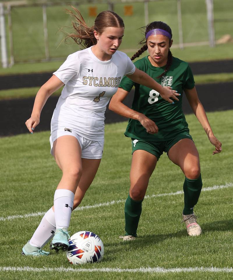 Sycamore's Lizzie Goff holds off Boylan's Johanna Hawley during their Class 2A sectional semifinal game Tuesday, May 21, 2024, at Belvidere High School.