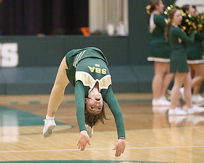 St. Bede cheerleader Molly Gonzalez does a back flip during a timeout on Monday, Dec. 14, 2022 at St. Bede Academy.