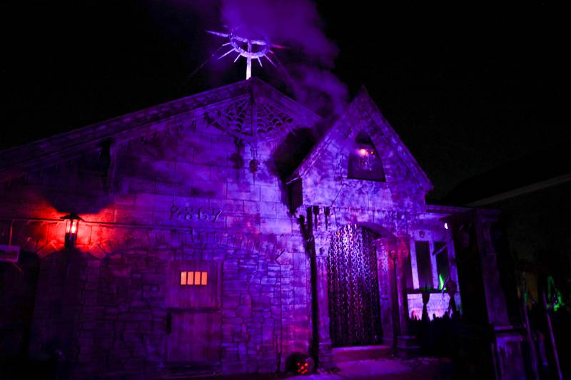 Jeff Eggener, a New Lenox carpenter, spent over a month re-siding his house, installing the plywood “haunted house” facade. Tuesday, Oct. 4, 2022, in New Lenox.