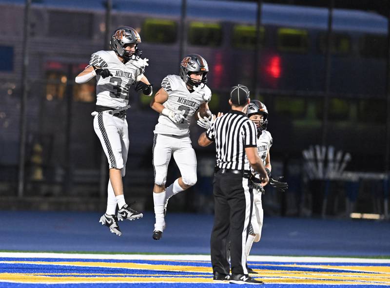 Minooka's Ty Couch and Jaden Boe celebrate in the end zone during a non-conference game against Joliet Central on Friday, Sep 13, 2024 at Joliet. (Dean Reid for Shaw Local News Network)