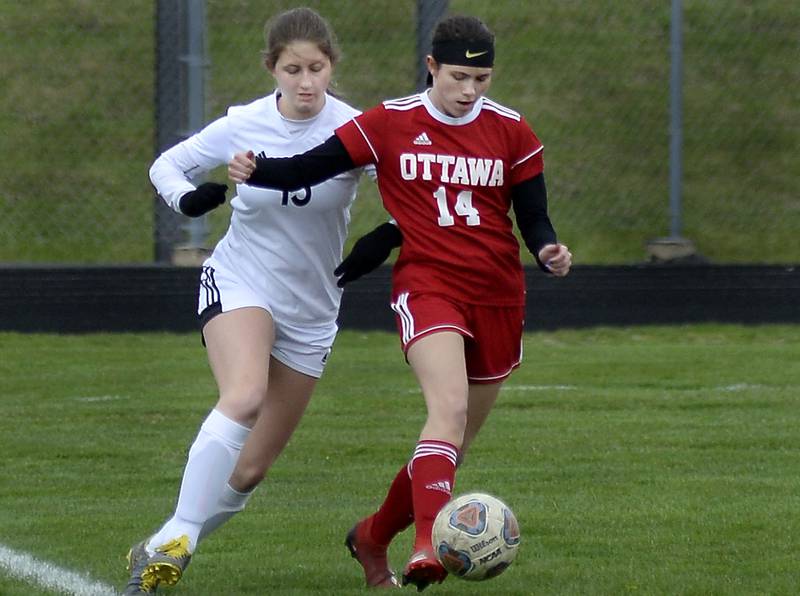 Ottawa’s Kalie Anderson and La Salle-Peru’s Isabella Lambert race for control of the ball during the first half of Wednesday's match at Ottawa on April 6, 2022.