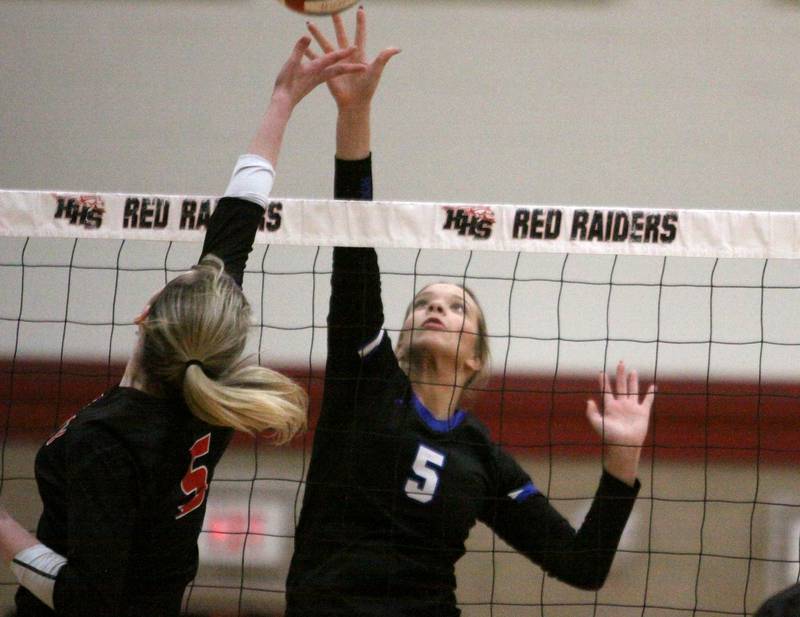 Huntley’s Emily Ernst, left, and Burlington Central’s Emily Maramba battle at the net in varsity volleyball at Huntley High School in Huntley on Thursday, Oct. 24, 2024.