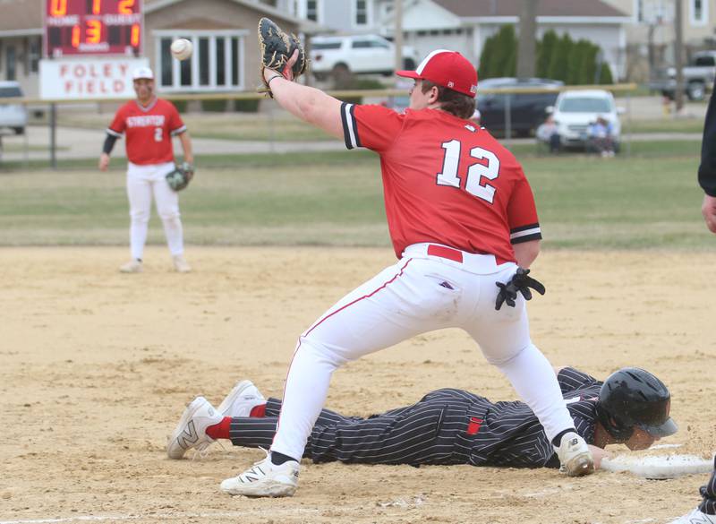 Streator first baseman Cole Winterrowd makes a catch at first base as Hall's Braden Curran dives safely back to the bag on Tuesday, March 18, 2025 in Foley Field at Kirby Park in Spring Valley.