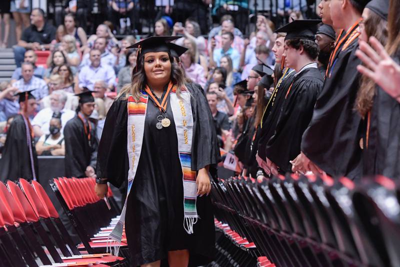 Graduates process in during the DeKalb High School graduation ceremony at the Convocation Center in DeKalb on Saturday, May 28, 2022.