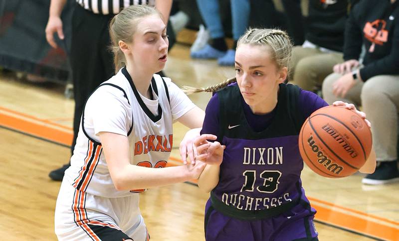 Dixon’s Kait Knipple tries to drive around DeKalb's Olivia Schermerhorn during their game Monday, Jan. 23, 2023, at DeKalb High School.