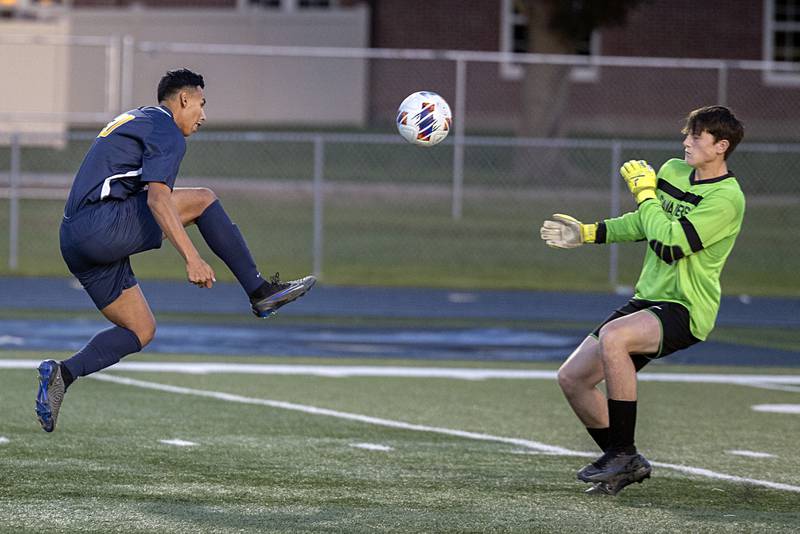 Sterling’s Felipe Sandoval tips the ball over against Lasalle-Peru goalkeeper Jacob Gross to start the scoring Tuesday, Oct. 17, 2023 in a regional semifinal in Sterling. Sandoval had three near identical goals in the first half.