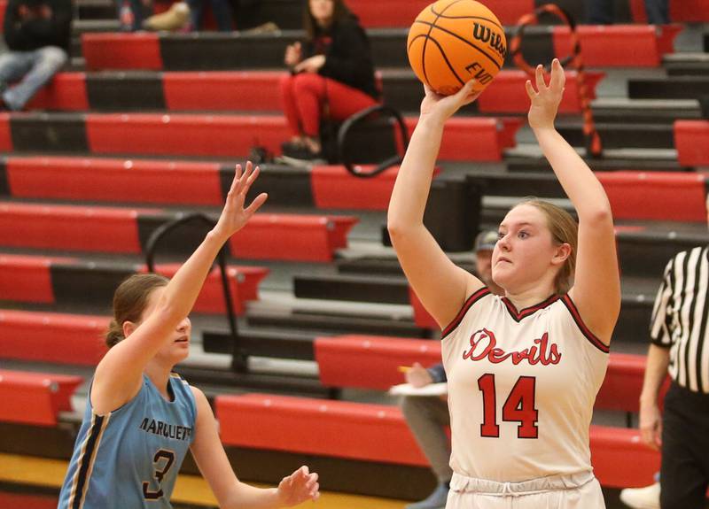 Hall's Jocelyn King lets go of a jump shot over Marquette's Morgan Nelson on Thursday, Feb. 13, 2025 at Hall High School.