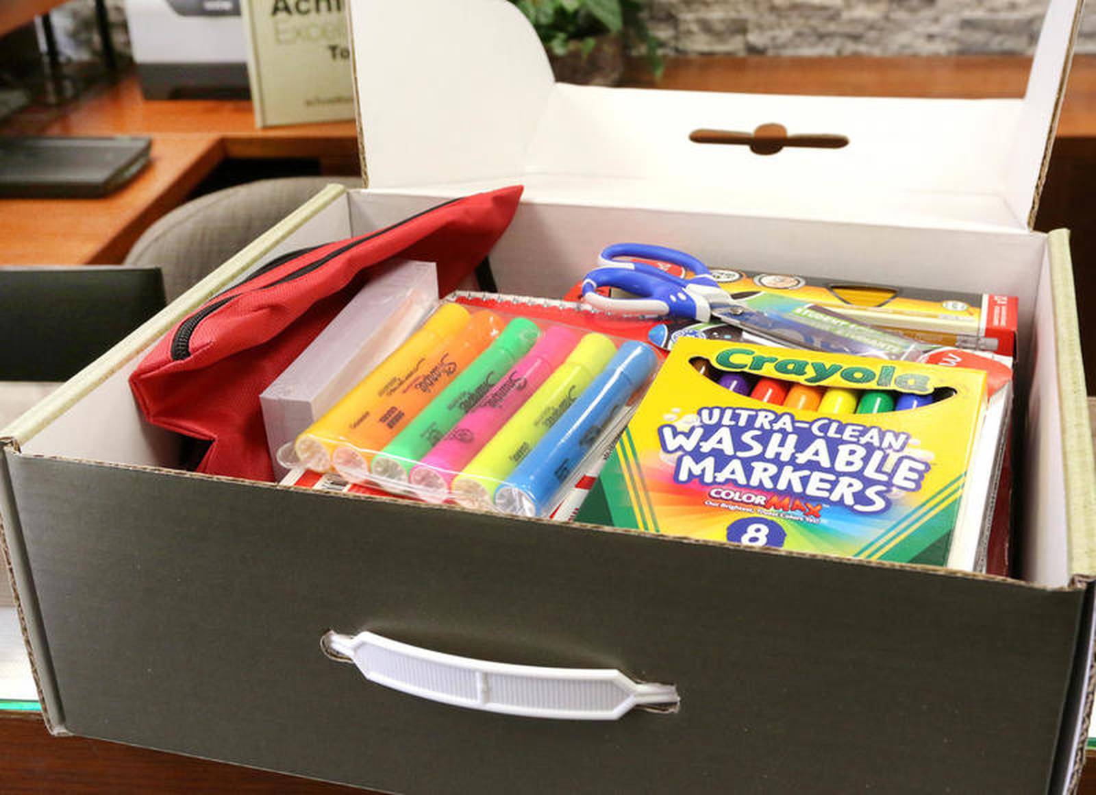 Community collaboration provides 400 school supply boxes to DeKalb