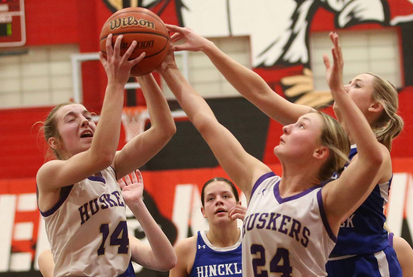 Serena's Macy Mahler grabs a rebound with the help of teammate Anna Hjerpe as the ball gets out of reach by Hinckley-Big Rock's Anna Herrmann during the Little Ten Conference championship game on Friday, Jan. 24, 2025 at Earlville High School.
