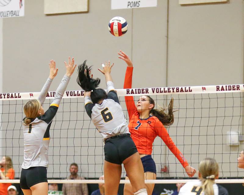 Oswego's Hannah Herrick (7) tips the ball over the net during Class 4A Bolingbrook Sectional semifinal match between Joliet West at Oswego.  Nov 5, 2024  in Bolingbrook.