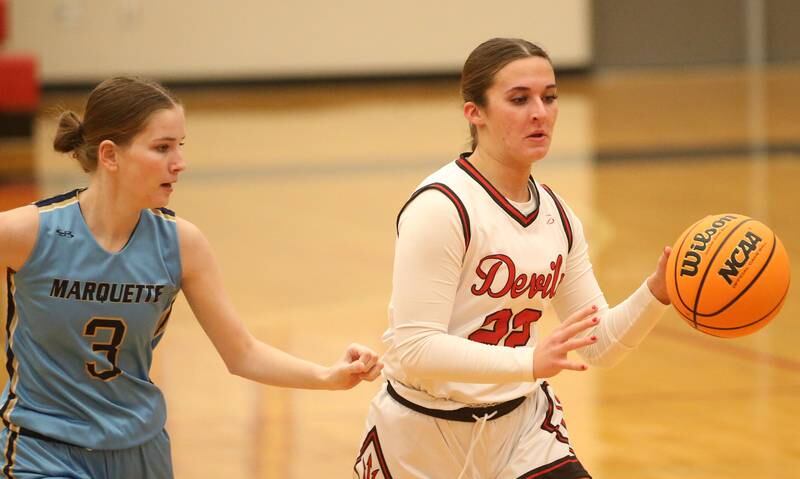 Hall's Kennedy Wozniak sprints down the floor as Marquette's Morgan Nelson defends on Thursday, Feb. 13, 2025 at Hall High School.