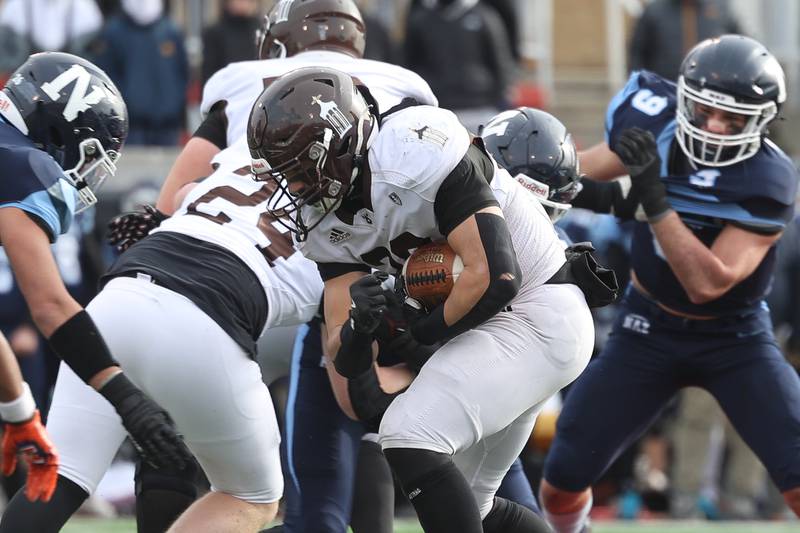 Joliet Catholic’s Nate Magrini powers through the line against Nazareth in the Class 5A state championship on Saturday, Nov. 30, 2024 in Normal.
