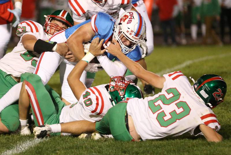 Ottawa's Jace Vieth is wrapped up by L-P's Cameron Taylor, Nick Hackenbergerand and Zack Pocivasek on Friday, Oct. 4, 2024 at King Field.