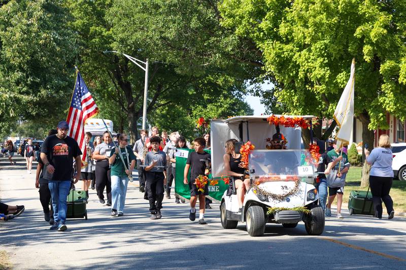The St. Anne Grade School marching band performs in the Grand Pumpkin Parade during the St. Anne Pumpkin Festival on Saturday, Oct. 4, 2025.