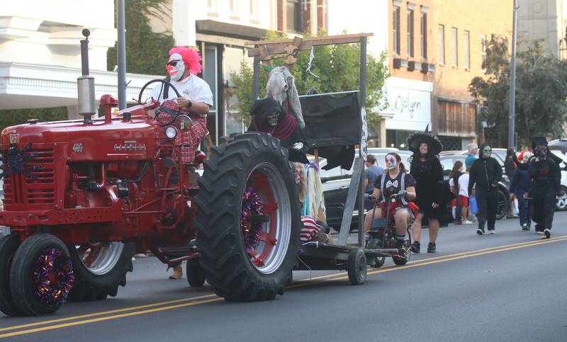 Characters from the Nightmare on Fairgrounds Road Haunted Attraction walk in the 6th annual Halloween parade on Saturday, Oct. 12, 2024 downtown Princeton.