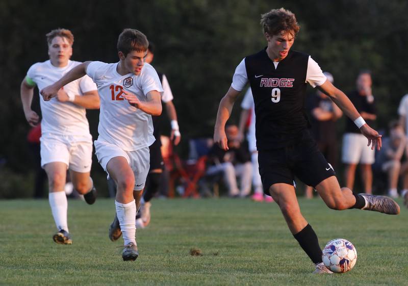 Prairie Ridge's Henry Knoll takes a shot on goal during a Fox Valley Conference soccer match against Crystal Lake Central on Thursday, Oct. 10, 2024, at Prairie Ridge High School.