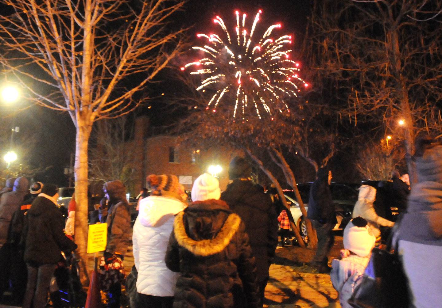 The crowd at the Jordan block watches the Festival of Lights fireworks in downtown Ottawa on Friday, Nov. 26, 2021.