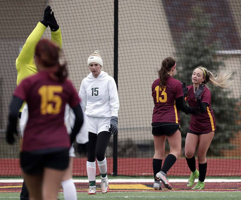 Schaumburg's Emma Salatino, right, is congratulated by Mya Rubio after her goal against Crystal Lake South during girls soccer action Saturday, March 26, 2022 in Schaumburg.