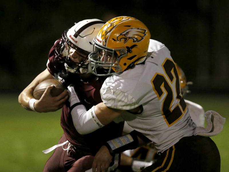 Prairie Ridge's Tyler Vasey fights for extra yards as he is tackle by Jacobs' Ashton Niehaus during a Fox Valley Conference football game between Jacobs and Prairie Ridge Friday, Sept. 16, 2022, at Jacobs High School in Algonquin.