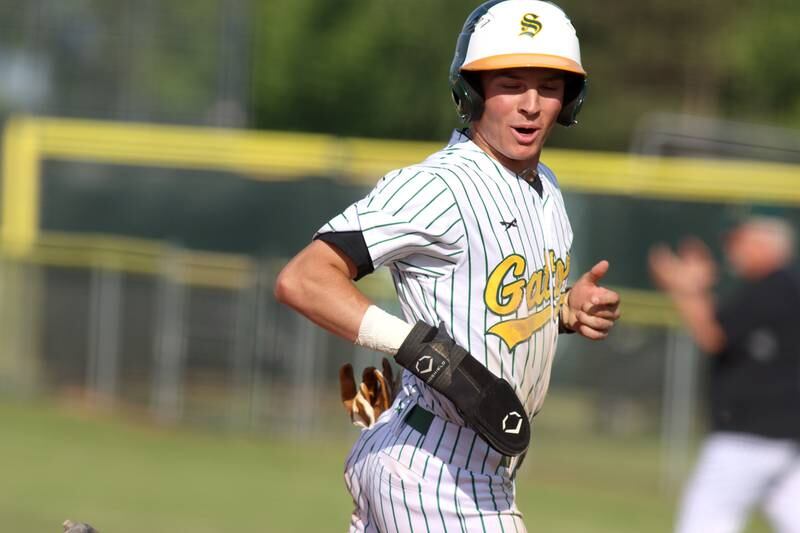 Crystal Lake South’s Dayton Murphy crosses home to score against Lake Forest in Class 3A baseball regional action at Crystal Lake Thursday.
