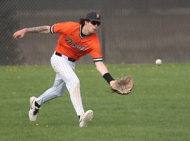 DeKalb's Cole Latimer makes a running catch Monday, April 28, 2025, during their game against Naperville Central at DeKalb High School.
