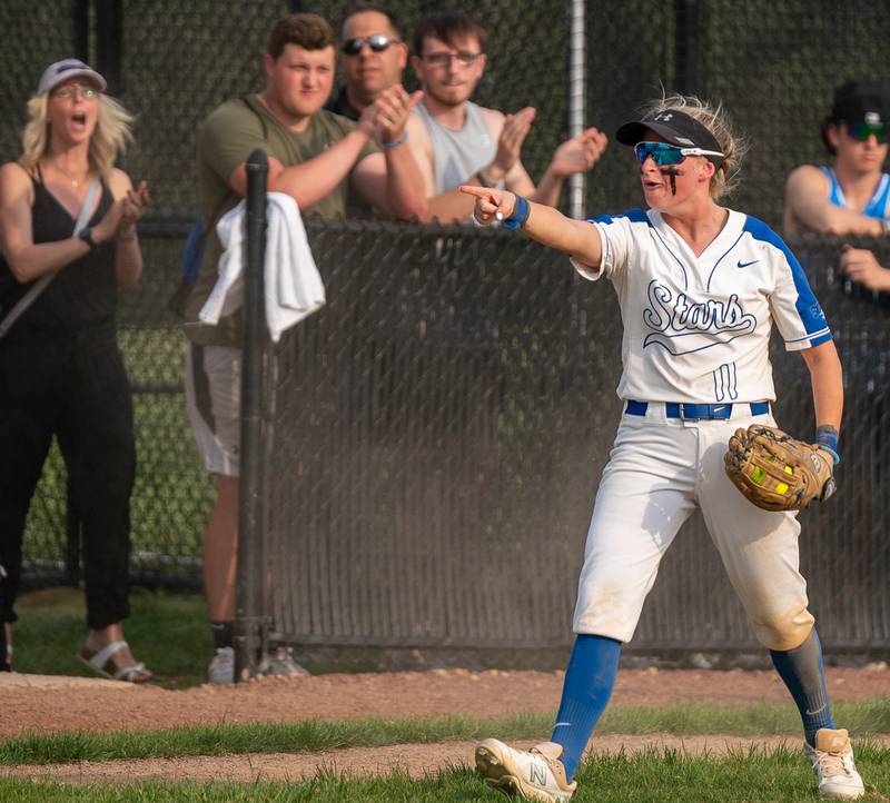 St. Charles North's Auburn Roberson (11) acknowledges Catcher Sophia Olman (not picured) after executing a pickoff play at third against Lake Park during a softball game at St. Charles North High School on Wednesday, May 11, 2022.