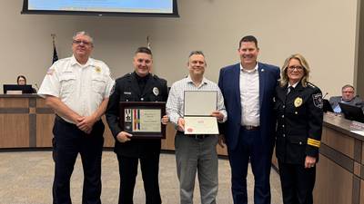 Morris police officer and civilian honored for saving a life on the Illinois River in August
