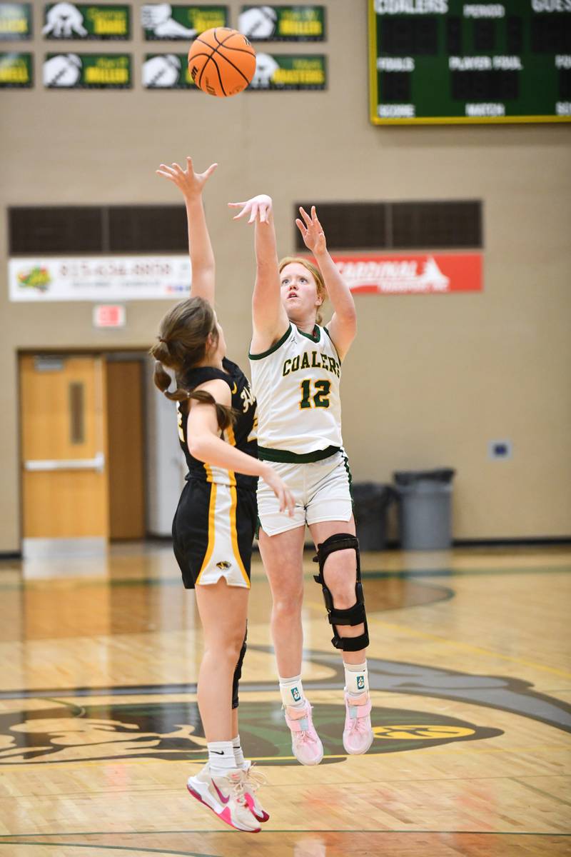Coal City's Jori Tucker shoots under pressure from Herscher's Avery Wright on Monday, Feb. 3, 2025, during the Coalers' victory over Herscher at Coal City High School.