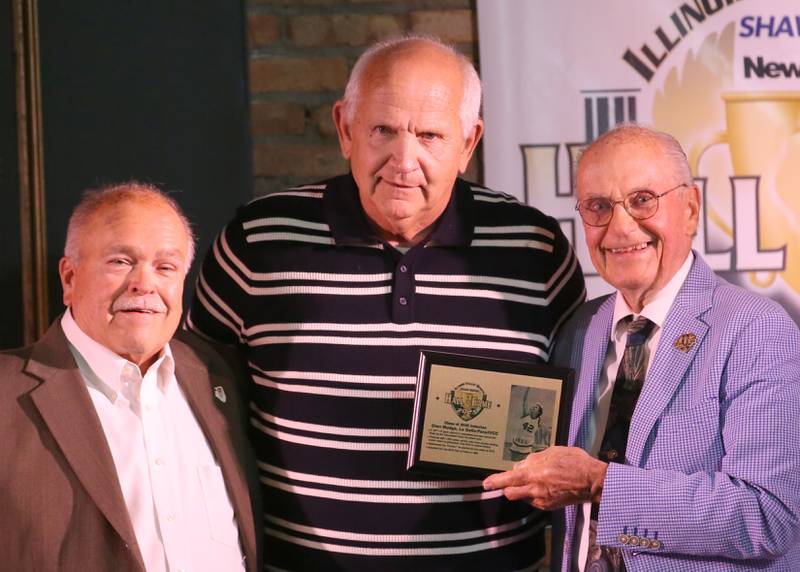 Former La Salle-Peru/IVCC boys basketball star Glen Mudge, poses with emcees Rick Sipovic and Lanny Slevin during the 2025 Shaw Media Illinois Valley Sports Hall of Fame at the Auditorium Ballroom in La Salle.