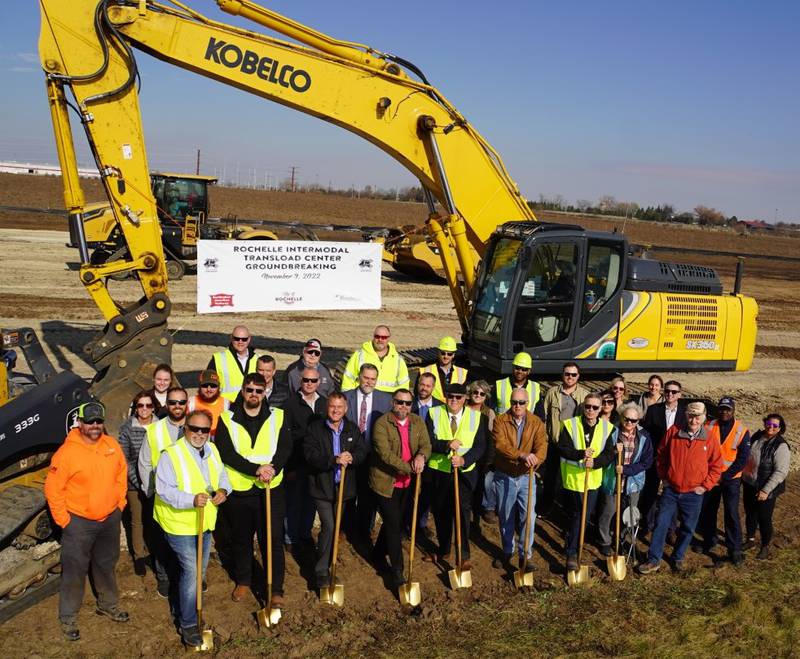 City of Rochelle officials as well as economic development and railroad leaders break ground on the city's new intermodal transload center.